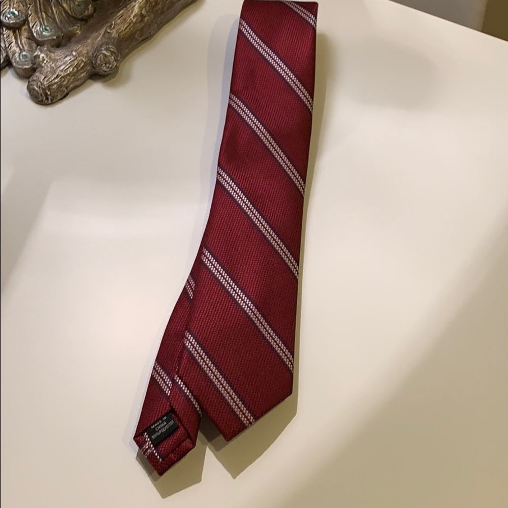 Red tie with blue and white stripes